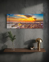 Aerial panoramic view of Venice at sunset, a great domed basilica and terracotta rooftops glowing beneath a fiery orange and blue sky over the lagoon. panoramic glass wall art D