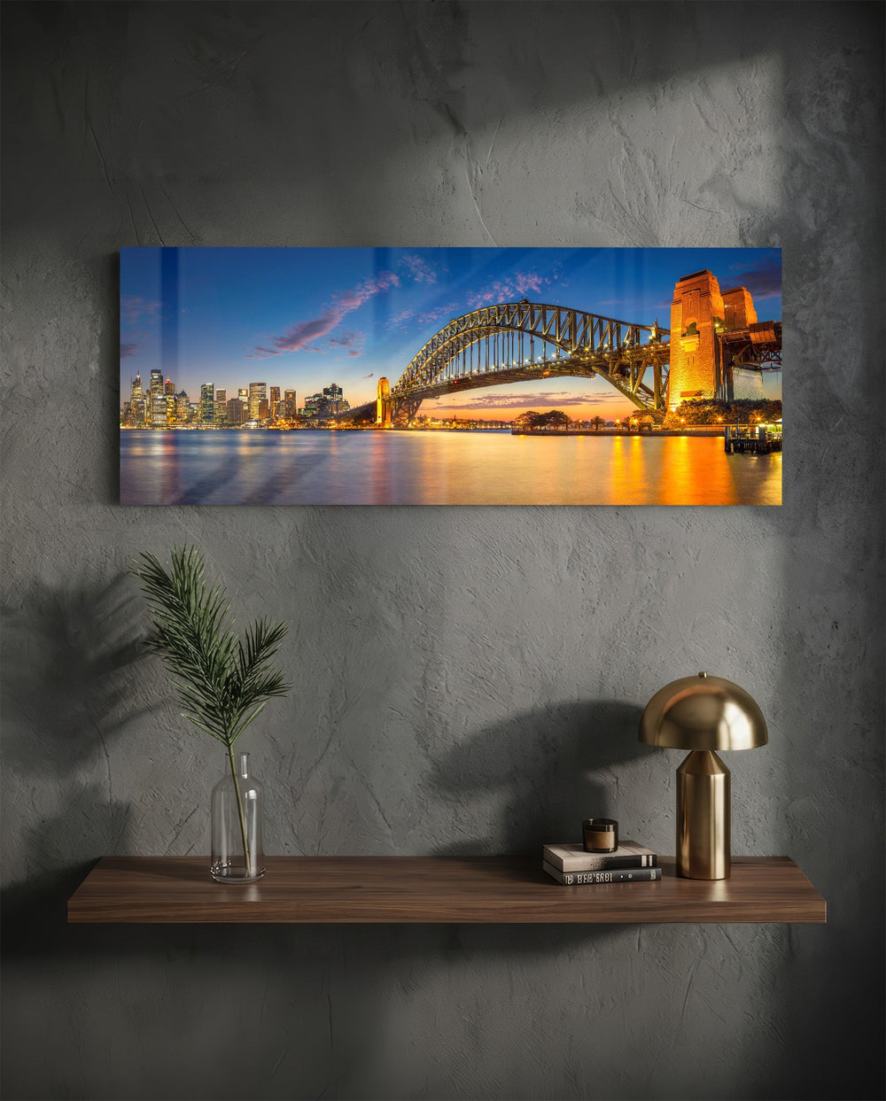 Panoramic harbor city at dusk, a great steel arch bridge lit gold beside a glittering downtown skyline mirrored in calm water. panoramic glass wall art D