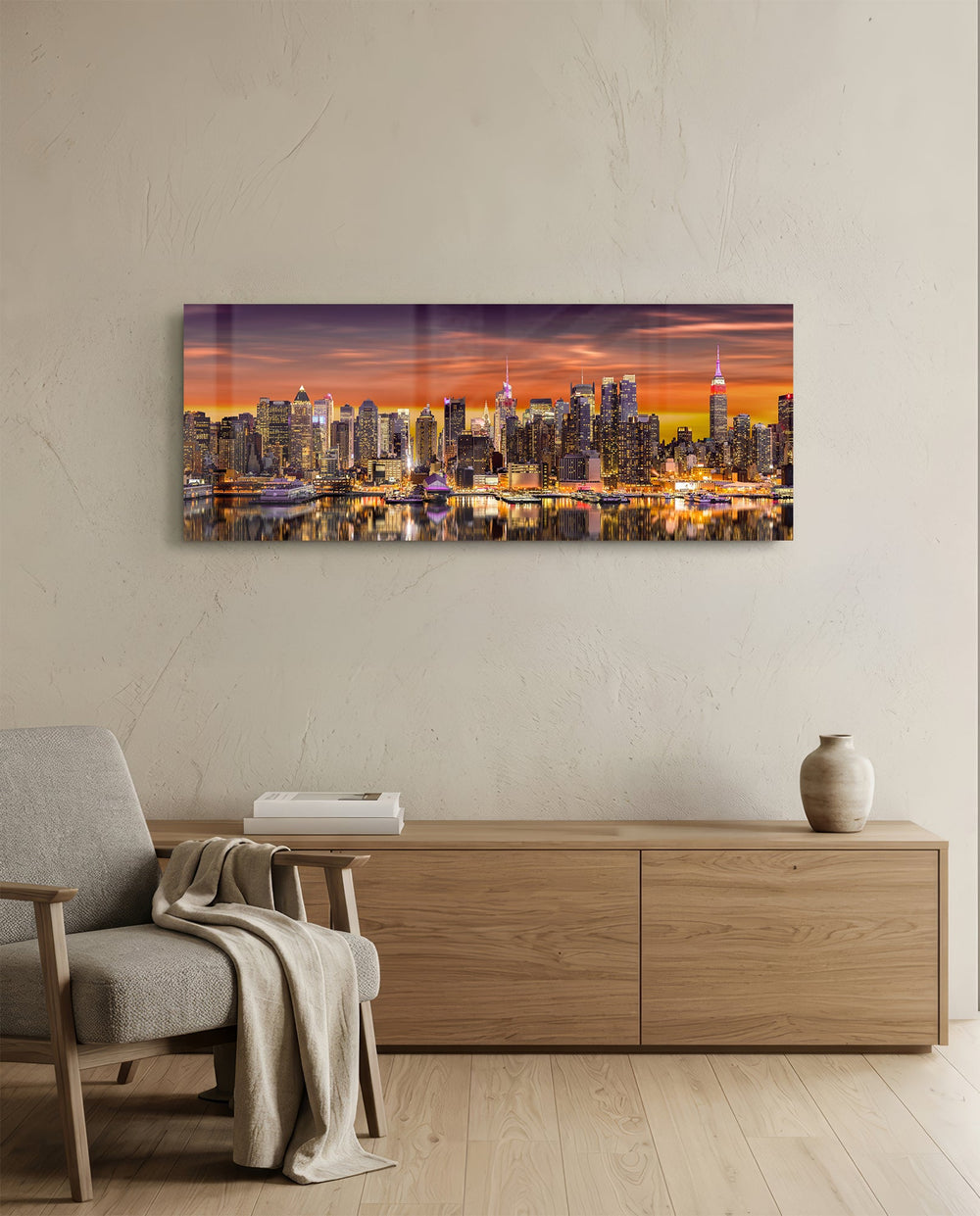 Panoramic metropolitan skyline at sunset, dense illuminated skyscrapers glowing beneath a fiery orange and violet sky, mirrored in the river below. panoramic glass wall art A