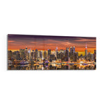 Panoramic metropolitan skyline at sunset, dense illuminated skyscrapers glowing beneath a fiery orange and violet sky, mirrored in the river below. panoramic glass wall art F