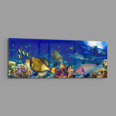 Vivid underwater panorama of a tropical coral reef alive with colorful fish, sunlight rippling through deep blue water. panoramic glass wall art E