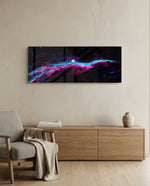 A vivid deep-space nebula with pink and turquoise gas filaments stretching across a starry black sky. panoramic glass wall art A