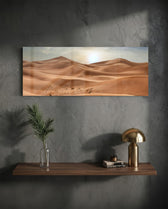 Rolling golden sand dunes rippling toward the horizon under a soft, hazy sun low in a pale sky. panoramic glass wall art D