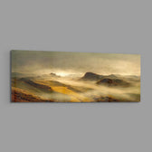 A dreamy valley of rolling green and golden hills wrapped in soft morning mist and warm sunrise light. panoramic glass wall art E