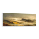 A dreamy valley of rolling green and golden hills wrapped in soft morning mist and warm sunrise light. panoramic glass wall art F
