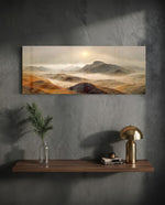 A rugged range of ochre and red-brown mountains and hills wrapped in drifting fog beneath a pale rising sun. panoramic glass wall art D