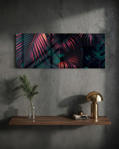 A moody close-up of tropical palm fronds glowing neon pink against deep, dark green jungle foliage. panoramic glass wall art D