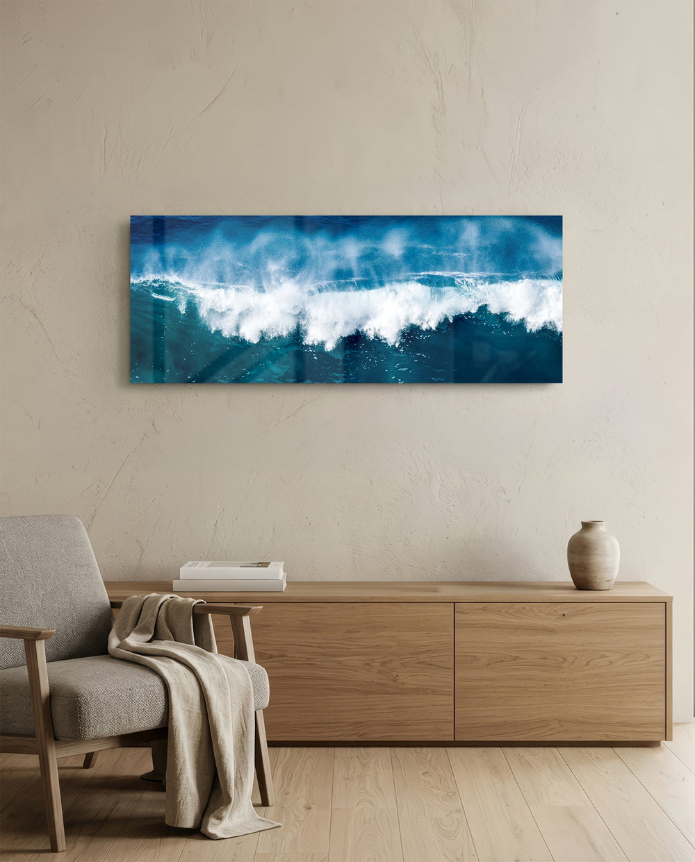 A powerful blue ocean wave breaking into white foam and spray across a wide panoramic seascape. panoramic glass wall art A