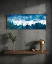A powerful blue ocean wave breaking into white foam and spray across a wide panoramic seascape. panoramic glass wall art D
