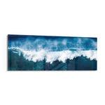 A powerful blue ocean wave breaking into white foam and spray across a wide panoramic seascape. panoramic glass wall art F