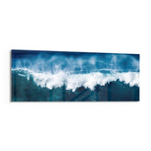 A powerful blue ocean wave breaking into white foam and spray across a wide panoramic seascape. panoramic glass wall art F