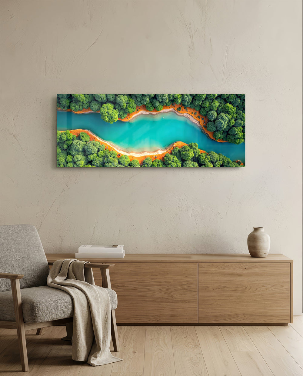 An aerial view of a winding turquoise river cutting through lush green forest with orange sandy banks. panoramic glass wall art A
