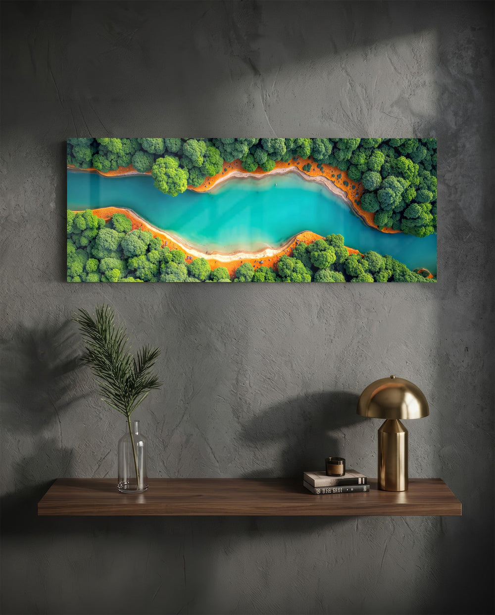 An aerial view of a winding turquoise river cutting through lush green forest with orange sandy banks. panoramic glass wall art D