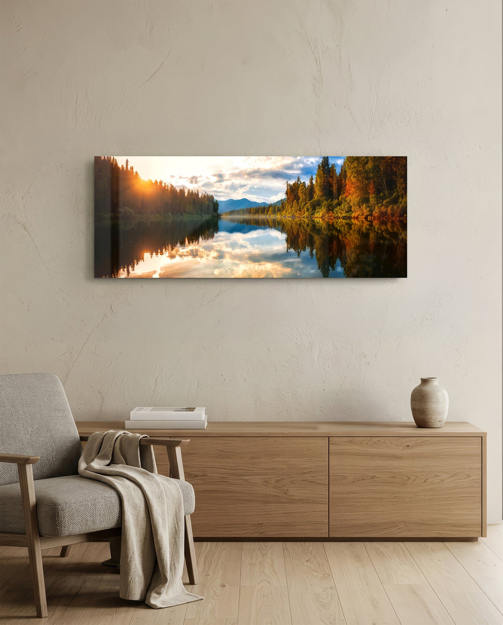 A mirror-calm lake at sunrise reflecting autumn forest, distant mountains, and a glowing cloudy sky. panoramic glass wall art A