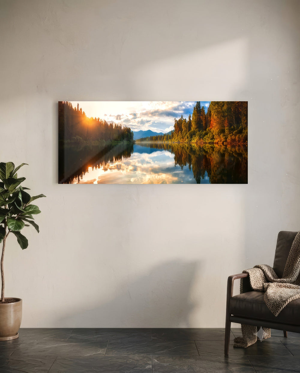 A mirror-calm lake at sunrise reflecting autumn forest, distant mountains, and a glowing cloudy sky. panoramic glass wall art C