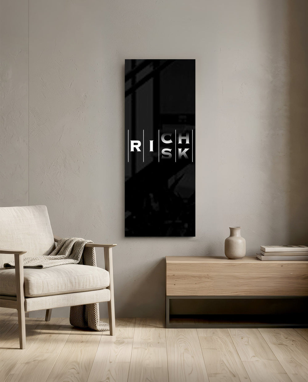 Minimalist black typography panel where the words "RISK" and "RICH" interlock in a single vertical column of white letters. panoramic glass wall art F