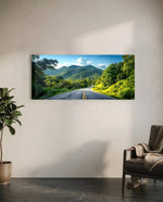 Panoramic view of an empty asphalt road curving through lush green tropical mountains under a bright blue sky. panoramic glass wall art C