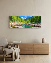 Illustrative panoramic landscape of a clear rocky river running through a bright green pine forest below mountains. panoramic glass wall art A