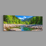 Illustrative panoramic landscape of a clear rocky river running through a bright green pine forest below mountains. panoramic glass wall art E