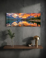 Snow-capped mountain peaks mirrored in a still alpine lake beneath a blazing golden sunset. panoramic glass wall art D