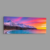 Snow-capped mountains under a vivid pink and orange twilight sky above a turquoise curving shoreline. panoramic glass wall art E