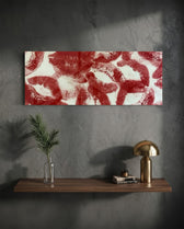 A scattered pattern of deep red lipstick kiss prints stamped across a creamy white surface panoramic glass wall art D