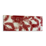 A scattered pattern of deep red lipstick kiss prints stamped across a creamy white surface panoramic glass wall art F