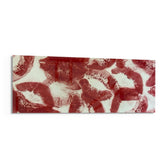 A scattered pattern of deep red lipstick kiss prints stamped across a creamy white surface panoramic glass wall art F