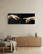 Two reaching hands on a black background with a buffering loading spinner glowing between their fingertips. panoramic glass wall art A