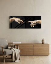 Two reaching hands on a black background with a buffering loading spinner glowing between their fingertips. panoramic glass wall art A