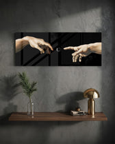 Two reaching hands on a black background with a buffering loading spinner glowing between their fingertips. panoramic glass wall art D