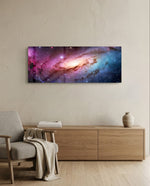 A glowing spiral galaxy swirling through clouds of pink, purple and blue across a star-filled cosmos. panoramic glass wall art A