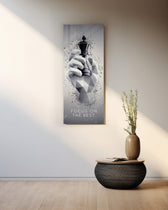 Low-poly monochrome hand grasping a black chess king as fragments burst around it. panoramic glass wall art A