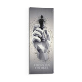 Low-poly monochrome hand grasping a black chess king as fragments burst around it. panoramic glass wall art D