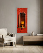 A seated figure reading on the sill of a terracotta-red arched niche, face hidden behind an open golden book. panoramic glass wall art F