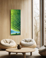 Two small figures sitting together on grass beneath a vast green tree, gazing over a calm blue lake toward distant mountains. panoramic glass wall art C
