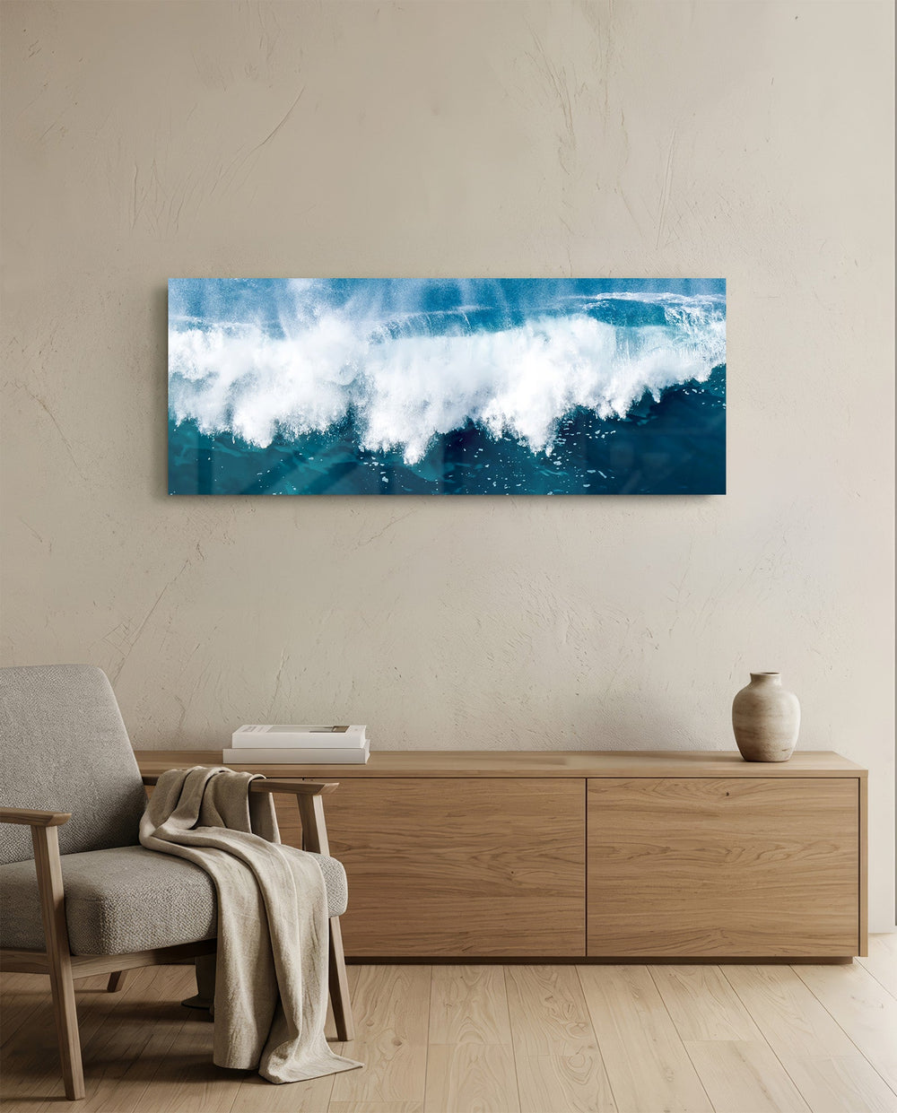 A powerful ocean wave breaking into white foam and spray against deep teal and blue sea water. panoramic glass wall art A