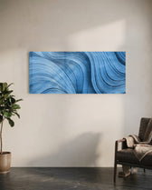 Sweeping abstract brushstroke waves in shades of blue with fine silvery, silk-like striations and shimmering metallic threads. panoramic glass wall art C