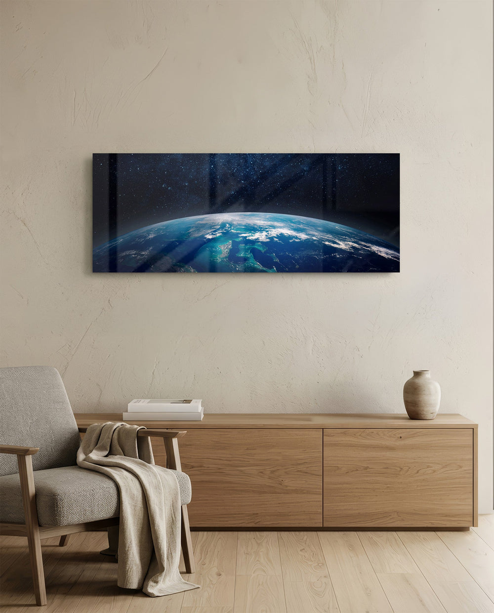 The curved edge of planet Earth seen from orbit, blue oceans and swirling clouds under a starry black sky. panoramic glass wall art A