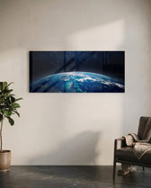 The curved edge of planet Earth seen from orbit, blue oceans and swirling clouds under a starry black sky. panoramic glass wall art C