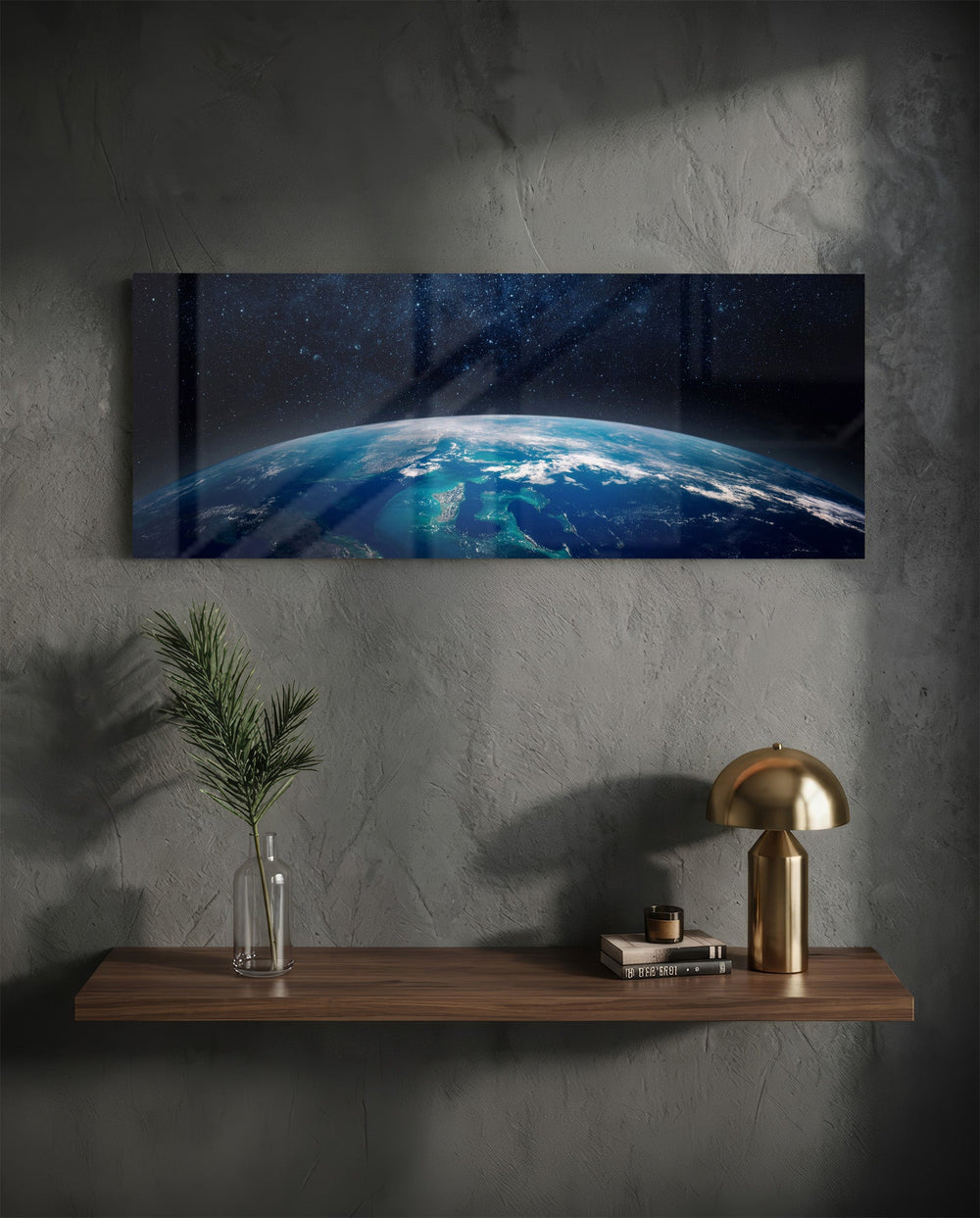 The curved edge of planet Earth seen from orbit, blue oceans and swirling clouds under a starry black sky. panoramic glass wall art D
