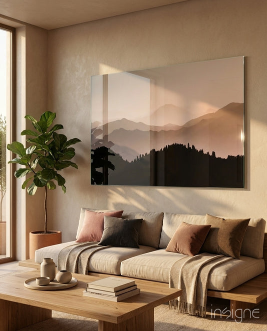 Mountains glass wall art displayed above a sofa in a contemporary living room