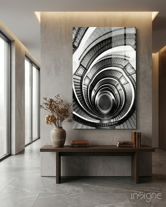 Loop glass wall art displayed above a console in a concrete foyer