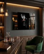 Joker glass wall art displayed above a whiskey bar in a wood-paneled lounge