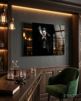 Joker glass wall art displayed above a whiskey bar in a wood-paneled lounge