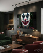 Joker glass wall art displayed above a sideboard in a dark-paneled lounge
