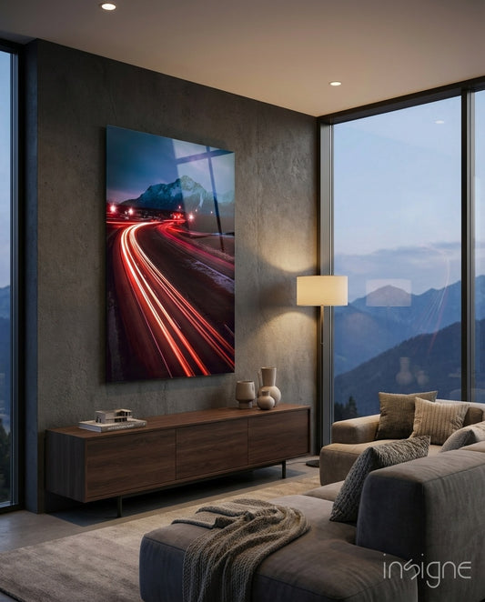 Road glass wall art displayed above a sideboard in a mountain-view living room