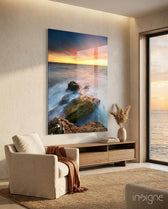 Coast Sunset glass wall art displayed above a wood console in an ocean-view living room