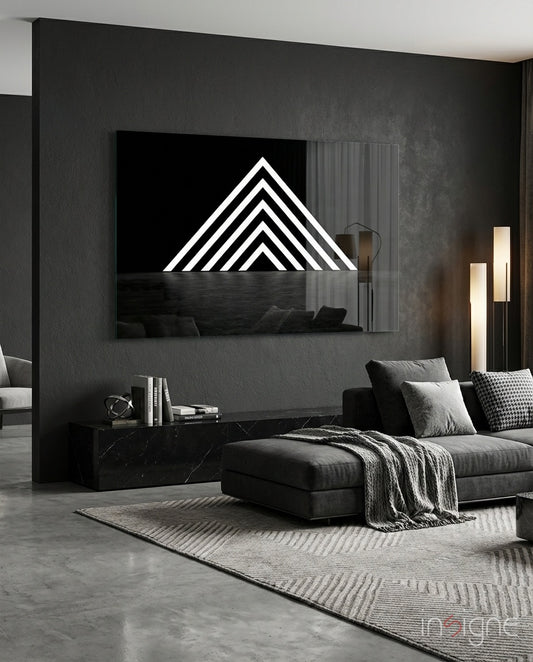 Triangle glass wall art displayed above a marble sideboard in a charcoal living room
