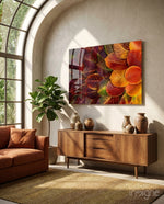 Autumn Leaves glass wall art displayed above a wood sideboard in a sunlit conservatory